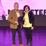 Heidi-Brauer-CMO-of-Hollard-presents-the-Marketer-of-the-Year-award-Francois-Viviers-Executive-Marketing-and-Communications